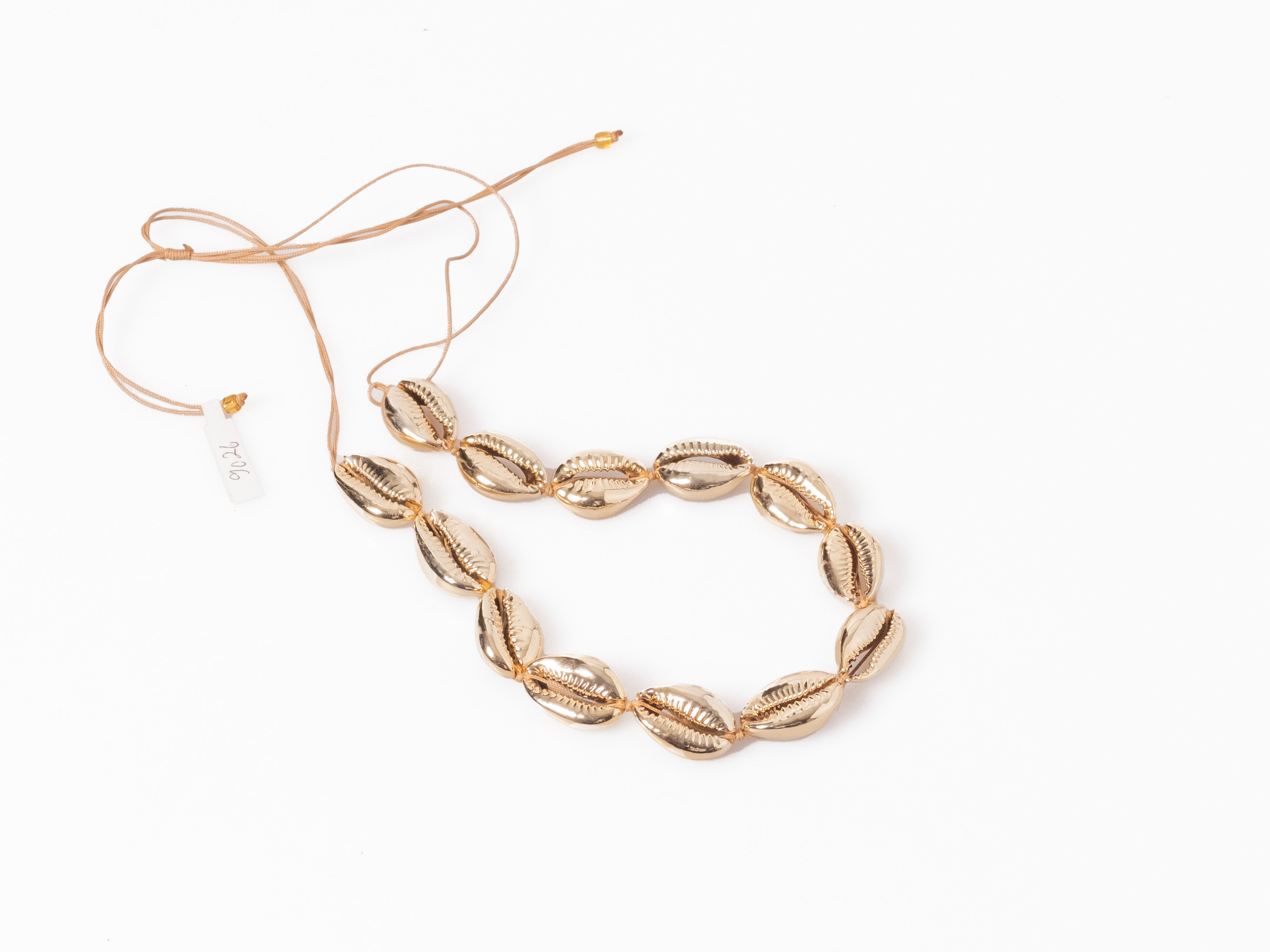 Bohnenkette Kette aus goldenen Kauri Muscheln größenverstellbar